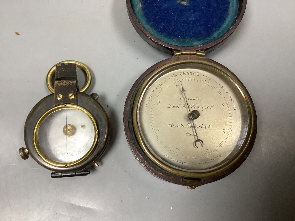 A pocket barometer, a compass, a 19th century desk stand and a photograph frame